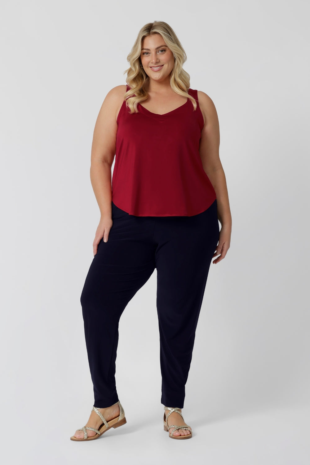 Plus sized woman wears red cami paired with travel friendly Indi Pant for a casual outfit. Made from high-quality slinky jersey fabric, it offers a luxurious feel while being an easy to care piece. This red cami is perfect for warmer weather to help cater to your summer celebrations. Proudly Australian made, this cami combines style and practicality, ensuring you stay cool and fashionable all season long. Leina & Fleur stock sizes 8-24.