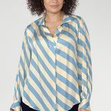 Silky and fluid on the body, it features a collared V-neckline with a tailored centre tuck and long cuffed sleeves with covered buttons. 