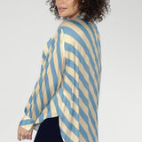 Designed as a refined oversized shirt, it transitions seamlessly from workdays to elevated events.