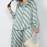 The sateen-weave fabric has a silky hand feel that drapes beautifully, making it ideal for warm-weather dressing.