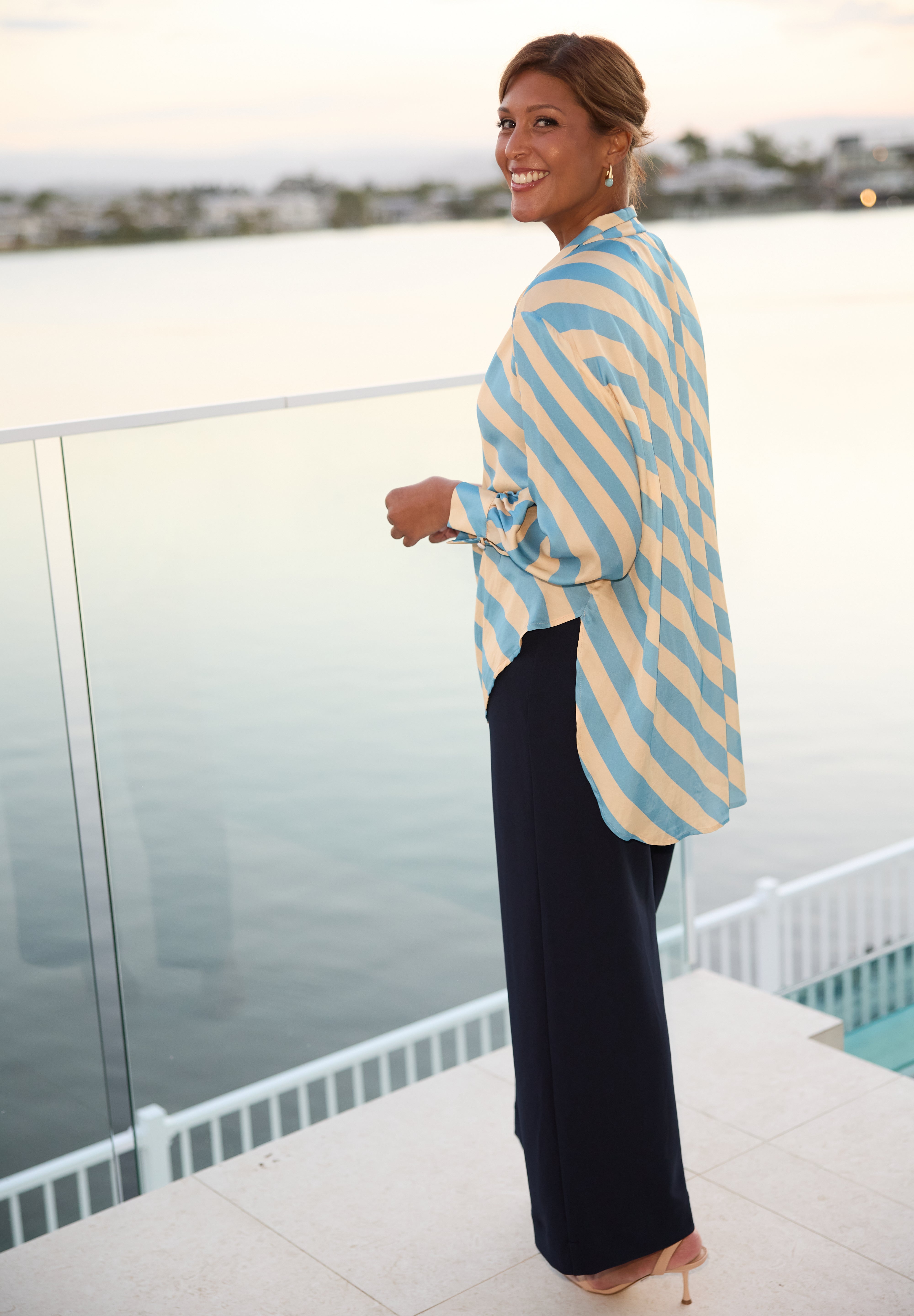 Featuring a sophisticated collared V-neckline, the Ellis Shirt is finished with a tailored centre tuck that adds subtle structure while maintaining an effortless silhouette. This thoughtful design detail creates polish without compromising comfort.