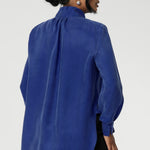 Suede touch Tencel shirt features a collared V-neckline, cuffed sleeves and shirttail hemline that sits longer at the back. Womans workwear blouse has a luxurious feel and drape. Proudly made in Australia in sizes 8-24.