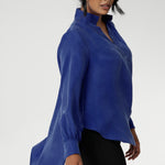 The Ellis Shirt in Cobalt has an oversized fit, designed to be worn loose or front-tucked. Ellis is a pull-on style shirt featuring a collared V-neckline, cuffed sleeves and shirttail hemline that sits longer at the back. Crafted from suede touch Tencel fabric that has a luxurious feel and drape. Proudly made in Australia in sizes 8-24.
