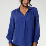 Ellis is a pull-on style shirt featuring a collared V-neckline, cuffed sleeves and shirttail hemline that sits longer at the back. Crafted from suede touch Tencel fabric that has a luxurious feel and drape. Proudly made in Australia in sizes 8-24.