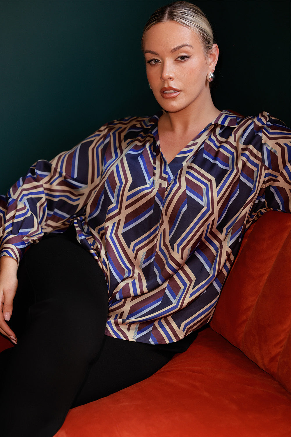 The Ellis Shirt is a contemporary swing-style top designed to bring ease and elegance to everyday dressing. Showcasing a bold geometric striped print, this eye-catching piece offers a fresh take on classic shirting with its flowing silhouette and modern detailing. Crafted for comfort and movement, the Ellis features an oversized fit that drapes beautifully and can be worn loose or styled with a front tuck for a more defined shape.