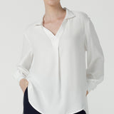 A size 10 woman wears the Ellis shirt in Vanilla tencel, a high quality made in Australia womens shirt made in breathable tencel. Inclusive size range 8-24 and made in Australia. 