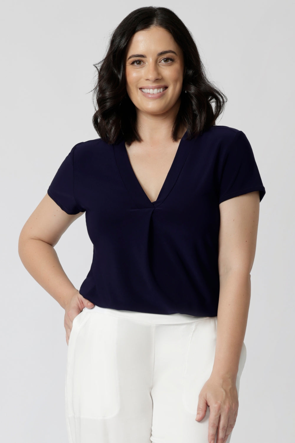 versatile tailored navy top with v-neckline and short sleeves