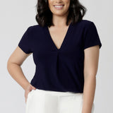 versatile tailored navy top with v-neckline and short sleeves