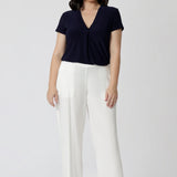  navy summer top worn with white pants