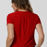 Back view of sleeved top red top. Crafted from dry touch jersey fabric to ensure a soft, dry breathable feel that is perfect for staying comfortable in the summer heat.  Top is made from easy-care fabric, making it an ideal piece for travel. Embrace summer with this vibrant and versatile piece. Shop now in sizes 8-24.