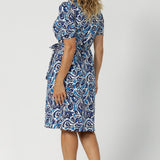 This wrap dress is as comfortable as it is flattering, draping beautifully over the body while offering ease of movement. The print, a sophisticated mix of white and varying shades of blue, adds a modern yet timeless feel, making it an ideal addition to any wardrobe. Available in size 8-24