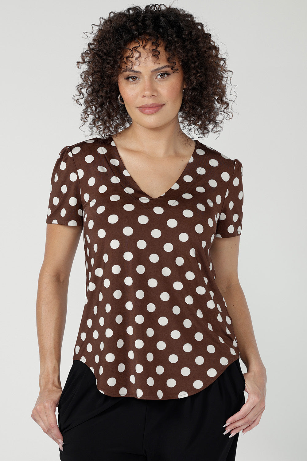 Crafted from slinky jersey fabric, the Evan Top in Choc Spot blends relaxed tailoring with elevated design details.