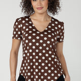 Crafted from slinky jersey fabric, the Evan Top in Choc Spot blends relaxed tailoring with elevated design details.