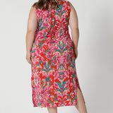 Back view of plus sized model wears lightweight crepe jersey, the dress offers a breathable and soft texture, ensuring comfort even on the warmest days. Leina & Fleur proudly stock petite and plus sizes ranging from 8-24. 