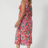 Tropical printed dress worn by over 40 model embodies the essence of a resort lifestyle. The fabric has a slight stretch, providing a flattering, flexible fit that moves with you. Its effortless design and relaxed silhouette make it a versatile addition to your summer wardrobe, ideal for both daytime adventures and evening strolls by the shore. Stocked in sizes 8-24.