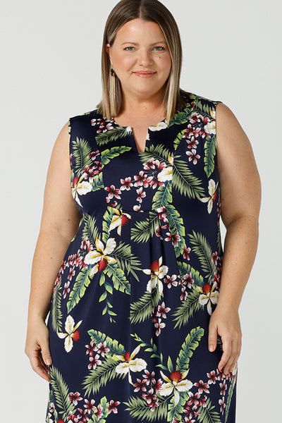 Close up details of a plus size designed for plus size women, the Fernanda dress is a jersey sleeveless dress with waist tie and v-neckline. The Fernanda dress features the Merriment print, the perfect print for your Christmas event or summer tropical festivities. Made in Australia for woman sizes 8 - 24.
