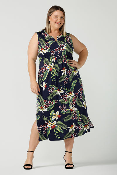 A plus size cDesigned for plus size women, the Fernanda dress is a jersey sleeveless dress with waist tie and v-neckline. The Fernanda dress features the Merriment print, the perfect print for your Christmas event or summer tropical festivities. Made in Australia for woman sizes 8 - 24.