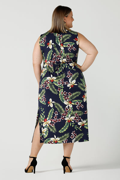 Back view of a plus size dress designed for plus size women, the Fernanda dress is a jersey sleeveless dress with waist tie and v-neckline. The Fernanda dress features the Merriment print, the perfect print for your Christmas event or summer tropical festivities. Made in Australia for woman sizes 8 - 24.