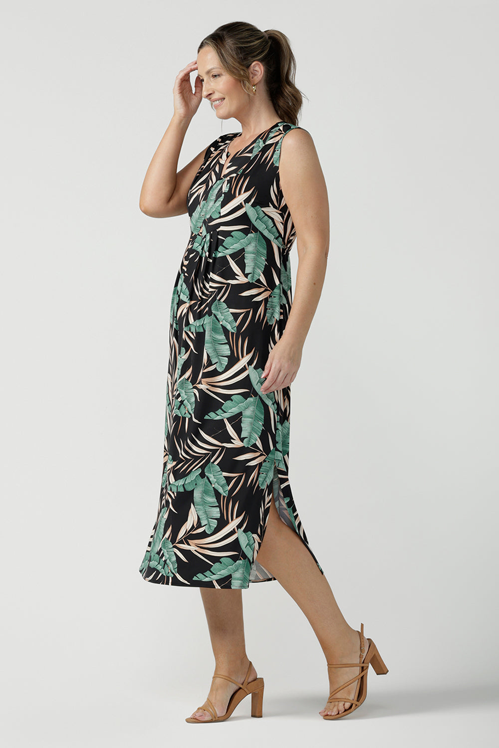 Women's curvy fashion pictured on a size 8. A Tropical printed dress in a sleeveless design with pleated front and v-neckline. Australian made in size 8 - 24. 