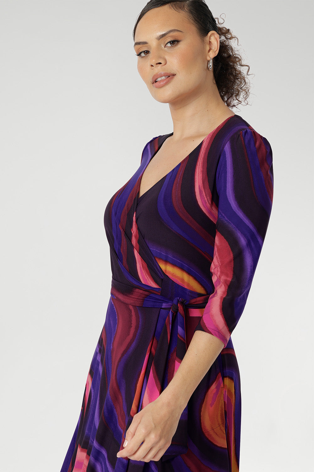 Fiona features a 3/4 sleeves with softly gathered sleeve heads and side pockets that enhance both the style and practicality of this piece. Model wears a size 10 wrap dress.