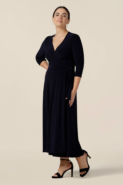 Shown for petite height women, this is an elegant navy blue wrap dress with 3/4 sleeves. With a full, midi skirt, this jersey dress is a good dress for evening and occasion wear. Made in Australia, shop dresses in sizes 8 to 24.