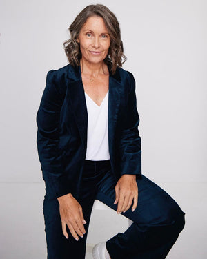 An Australian fashion for women over 50, L&F's 50 plus clothing guide features 3 fifty plus women. The over 50 woman show here wears a cocktail pant suit in green velveteen with a white bamboo jersey top.