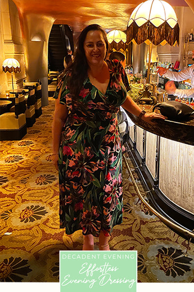 Showing the versatility of the Delaney Wrap Dress, a plus size, curvy woman shows how she wears this flutter sleeve wrap dress style for evening wear as well as day wear. 