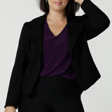 Size 10 woman wears the Garcia Jacket in Black. Tailored design with collar and comfortable stretch. Comfortable and stylish workwear for women. Size inclusive fashion and made in Australia for women size 8 - 24.