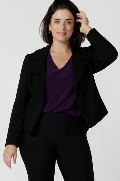 Size 10 woman wears the Garcia Jacket in Black. Tailored design with collar and comfortable stretch. Comfortable and stylish workwear for women. Size inclusive fashion and made in Australia for women size 8 - 24.