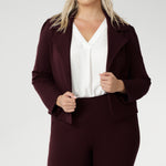 The Garcia Jacket in Burgundy is a modern cropped trench with a tailored, open-front design. Made from firm-stretch fabric, it’s an effortless layering piece for off-duty or workwear looks. Garcia features an open fronted jacket with collar and notch lapels with topstitch details. Double layer jacket is tailored with front panels and back darts. Proudly made in Australia in sizes 8-24.