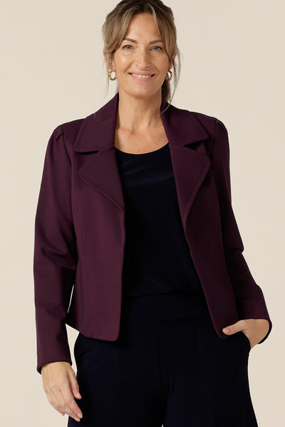 Model wears the Garcia Jacket in Mulberry ponte fabric by Australian and New Zealand women's clothing brand, L&F. Featuring collar and notch lapels and long sleeves, this open-fronted jacket is good for corporate wear and casual wear.