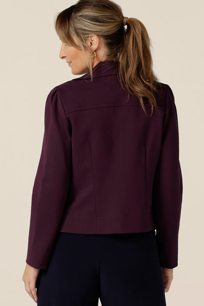 Model wears the Garcia Jacket in Mulberry ponte fabric by Australian and New Zealand women's clothing brand, L&F. Featuring collar and notch lapels and long sleeves, this open-fronted jacket is good for corporate wear and casual wear.