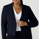 Size 16 woman wears the Garcia Jacket in Navy. Stylish comfortable workwear for women. Tailored with dry touch tech stretch jersey. Made in Australia size 8 - 24.