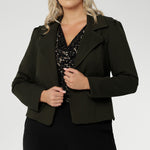 The Garcia Jacket in Olive is a contemporary take on the classic trench, reimagined in a rich, earthy tone that adds depth and versatility to your wardrobe. Crafted from premium dry-touch Ponte jersey fabric with firm stretch, this tailored, open-front jacket delivers both structure and comfort, making it an ideal layering piece for work, weekends, or travel.