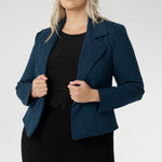Model wears the Garcia Jacket in Petrol ponte fabric by Australian and New Zealand women's clothing brand, L&F. Featuring collar and notch lapels and long sleeves, this open-fronted jacket is good for corporate wear and casual wear.