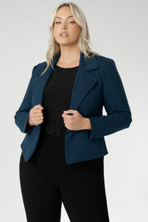 Model wears the Garcia Jacket in Petrol ponte fabric by Australian and New Zealand women's clothing brand, L&F. Featuring collar and notch lapels and long sleeves, this open-fronted jacket is good for corporate wear and casual wear.