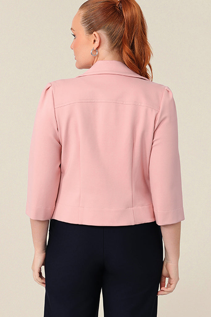 Back view of a tailored jacket with open front and collar and notch lapels is made in Blush pink ponte fabric. Shop exclusive luxury, this work jacket is available to pre-order at Australian and New Zealand women's clothing label, L&F.
