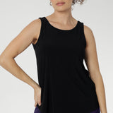 Reversible cami piece features a chic boat neckline and a sleek, streamlined silhouette that layers beautifully or shines on its own. Available in size 8-24.