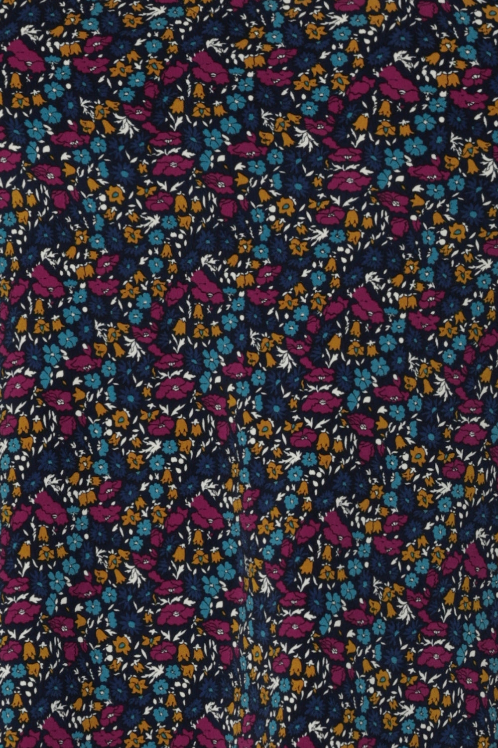 Close up swatch image of Harmony print, which features a navy dry-touch jersey base adorned with floral details in rich hues of magenta, mustard, blue, and vanilla. Used to create garments for a summer corporate wardrobe in sizes 8-24.