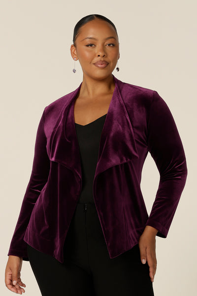 Occasionwear dressing at its finest, this soft tailoring jacket in red wine velour adds effortless glamour to black cocktail wear.  Shown here over a black cami top and slim leg black trousers, this open front, soft collared evening jacket is made in Australia in sizes 8 to 24.