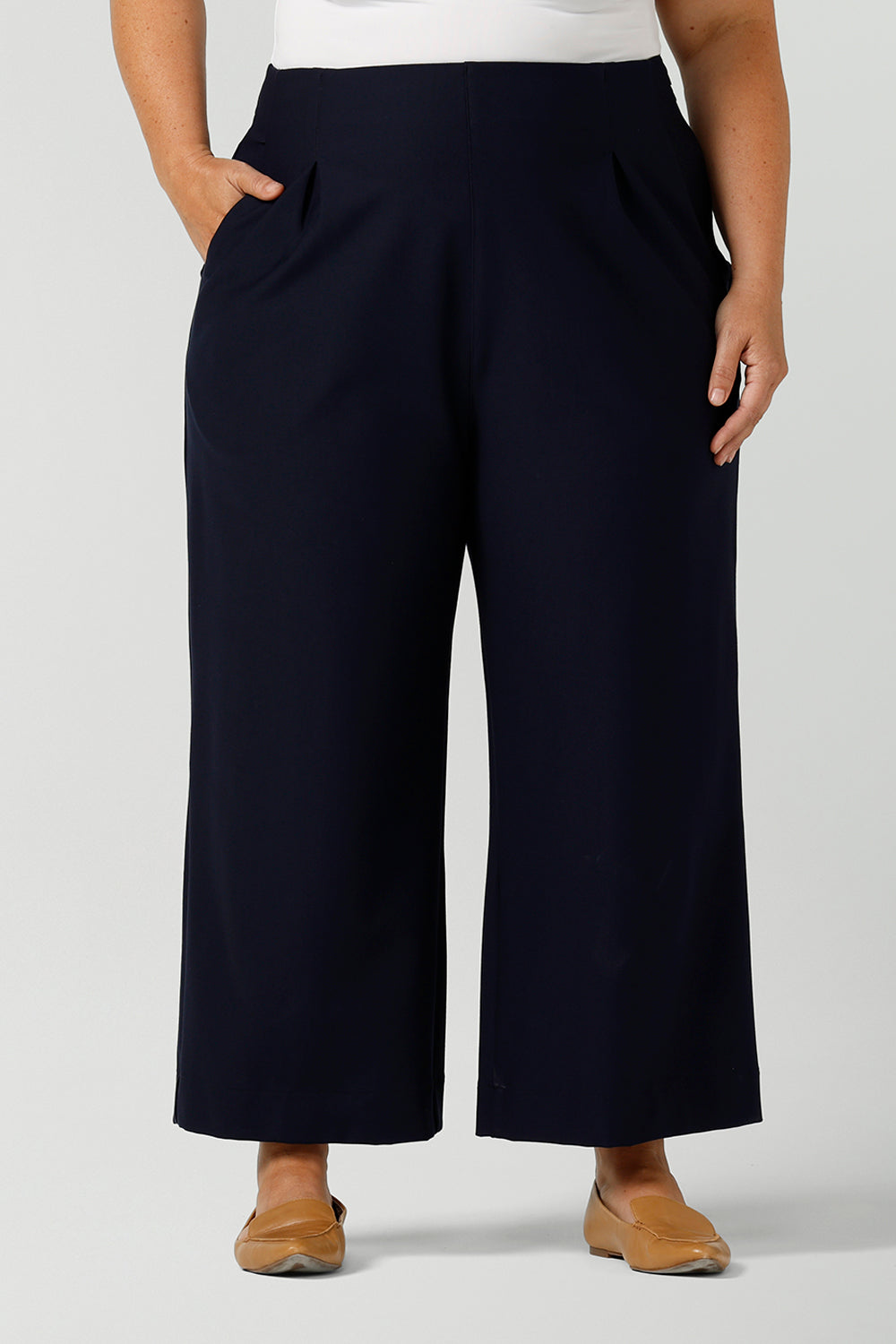 Wide-leg, cropped length Hollis Culotte Pant in Navy blue. Featuring front pleats, side pockets and stretch jersey fabric these are comfortable, plus size work pants. This tailored trouser delivers quality office wear to women in sizes 8 to 24. - shop now at Australian ladies clothing brand, Leina & Fleur's online boutique.