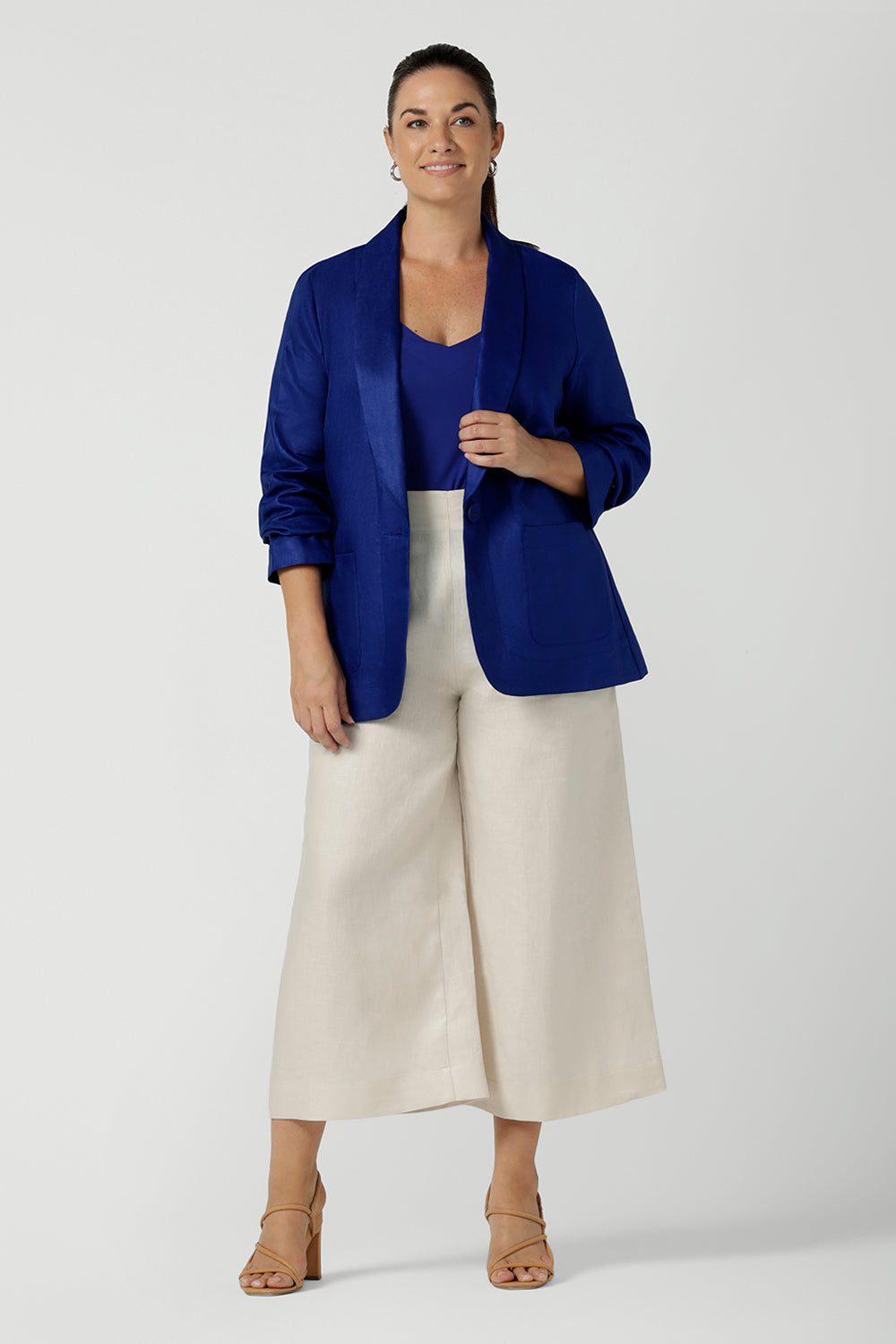Houston Blazer in Cobalt Linen. Softly tailored in Linen with front pockets and a functioning button front. Made in Australia for women size 8 - 24. Styled back with Nik Pants in Parchment Linen and a Cobalt Eddy cami top.