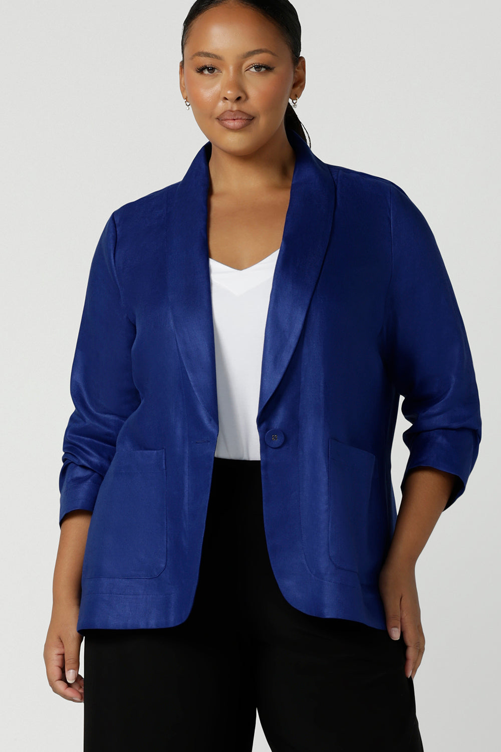 Houston Blazer in Cobalt Linen size 16. Softly tailored in Linen with front pockets and a functioning button front. Made in Australia for women size 8 - 24. Styled back with white Eddy cami top. 