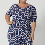 The cowl neckline adds a touch of sophistication and elegance to the design, while the elbow-length sleeves with tuck details at the shoulder provide a unique, refined look. Knee length dress also features subtle stretch at the waist, creating a smooth, defined shape that flatters your figure. Plus size model wears the Imelda Dress in a size 18.