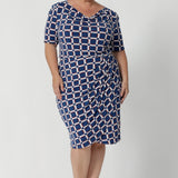 The tulip-shaped wrap skirt with tucks across the front brings an elegant flair, while the semi-fitted design provides just the right amount of structure without feeling restrictive. Plus size woman wears workwear dress is a size 18. Knee length dress is unlined, giving it a lightweight feel, wrap hemline offers a polished, professional yet feminine look that’s perfect for the office. 