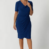 The Imelda Dress is the perfect blend of style and comfort, designed to elevate your workwear wardrobe with ease. This new shape dress combines the structured, professional look of a tailored dress with the convenience of a pull-on style, making it a versatile addition to any modern woman's closet. Available in sizes 8-24. Over 40's woman wears her blue dress in a size 12. 