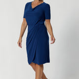 Crafted from a deep blue dry-touch jersey fabric, the dress features a soft stretch that moves with you, ensuring all-day comfort without sacrificing style. Imelda is on a deep blue dry touch jersey base. Fabric has a soft stretch. 