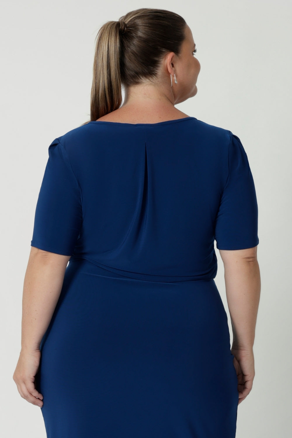 A centre-back tailored tuck enhances the fit, adding structure and a flattering silhouette. The dress also features subtle stretch at the waist, creating a smooth, defined shape that flatters your figure. Designed for women’s professional fashion, the Imelda Dress is your go-to for effortless style and comfort. Available in sizes 8-24.