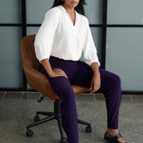 A size 10 Indi pant in Amethyst in a jersey workwear pant with pleat front and cuffed leg opening. Made in Australia for women size 8-24. Styled back with the Arley Shirt in Vanilla. 