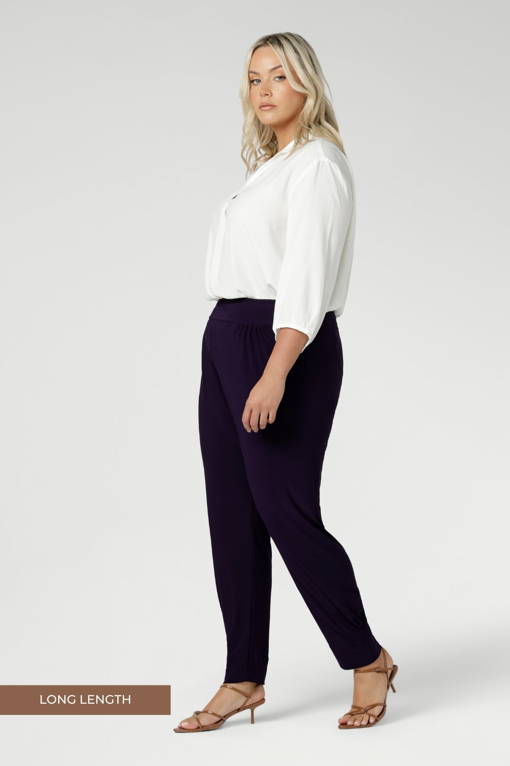 Made in Australia for women size 8-2 4 and now available in 2 lengths. Plus size woman wears stretchy travel pants made from dry touch jersey fabric. Workwear pant have a pleat front and cuffed leg opening. 